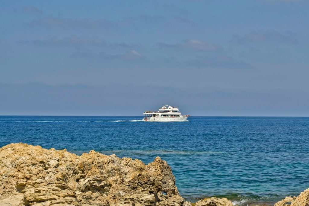 a boat is out in the ocean on a sunny day